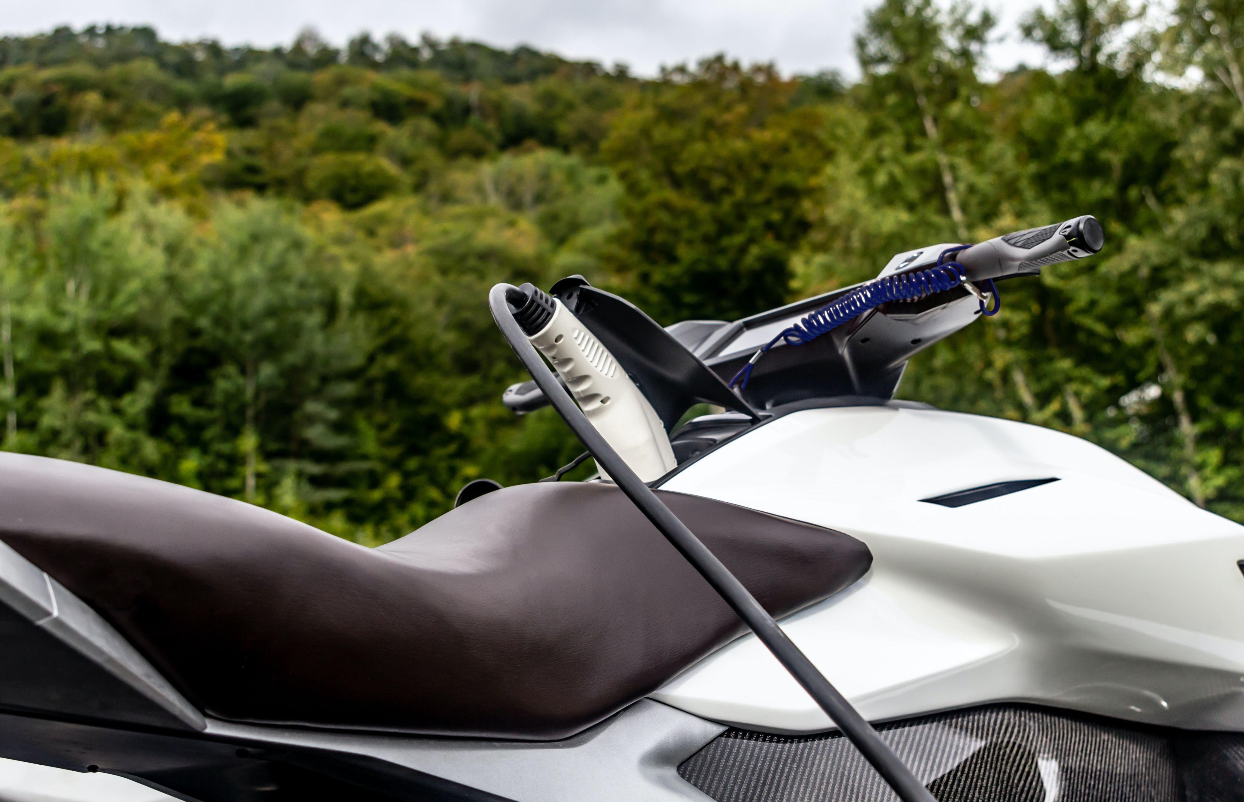 electric motor charging in front of trees